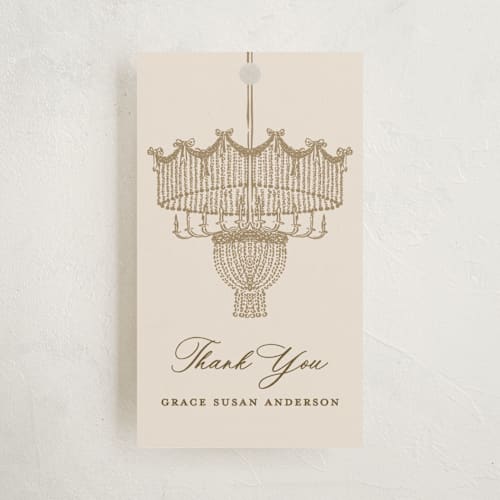This is a sand party favor tags with standard by Claudia Orengo called chandelier printing on signature in tag