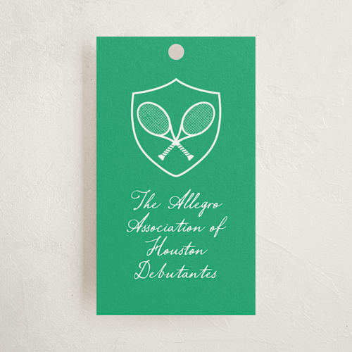 This is a grass party favor tags with standard by mo kelley called tennis crest printing on signature in tag