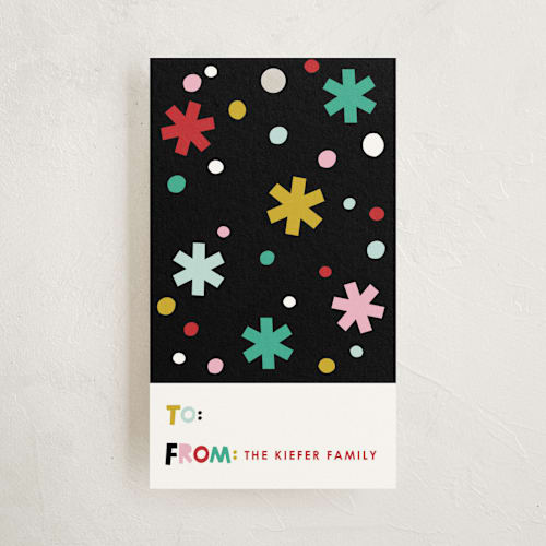 This is a snow gift tags with standard by Ampersand Design Studio called papercut holiday printing on signature in tag