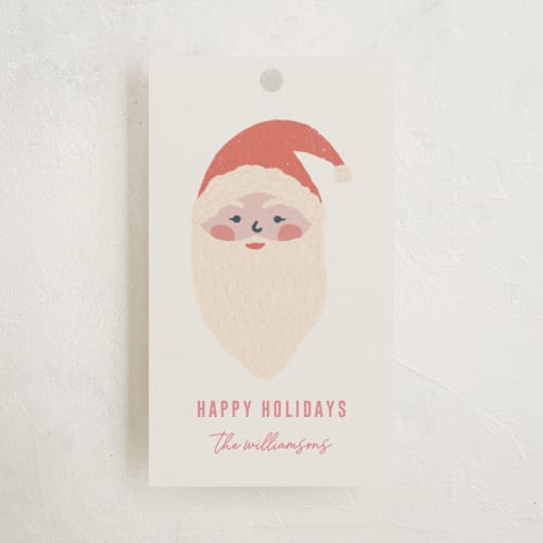 This is a cream gift tags by Rebecca Humphreys called holiday icons printing on signature in tag