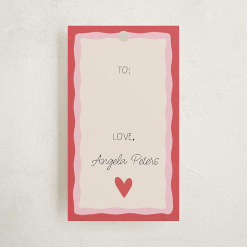 This is a heart gift tags with standard by Tina Faselli called a little love printing on signature in tag