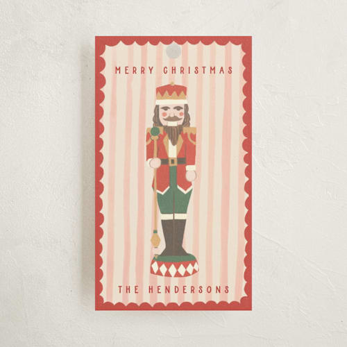 This is a poinsettia gift tags by Teju Reval called gilded nutcracker printing on signature in tag