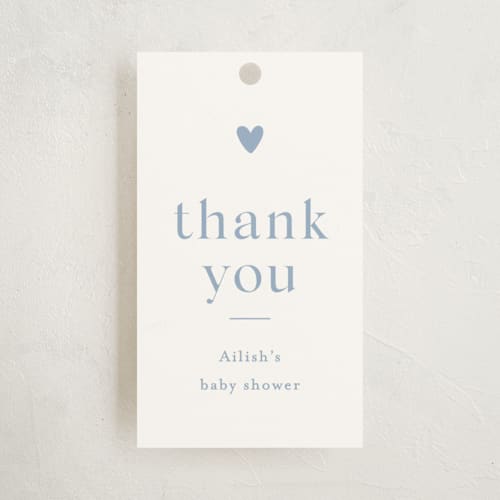 This is a provincial blue baby shower favor tags with standard by Stacey Meacham called heartbeat printing on signature in tag