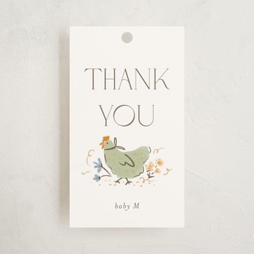 This is a cream baby shower favor tags with standard by Vera Lim called whimsical frame printing on signature in tag