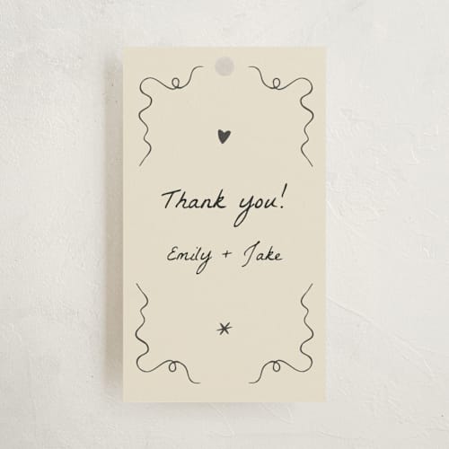This is a ivory baby shower favor tags with standard by Stephanie Heinrich Godbout called doodle sip and see printing on signature in tag