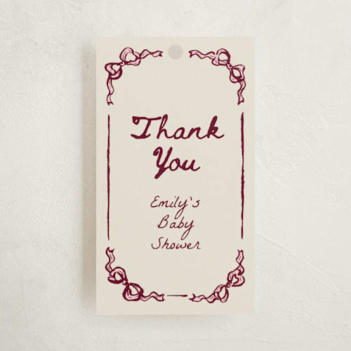 This is a rosewood baby shower favor tags with standard by Cass Loh called bow corners printing on signature in tag
