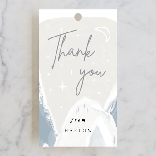 This is a snow baby shower favor tags with standard by Maja Cunningham called baby it's cold outside printing on signature in tag