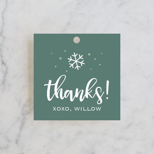 This is a gold kids gift tags with standard by Lorent and Leif called snowfall printing on signature in tag