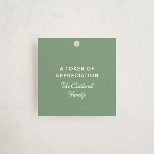 This is a green lawn party favor tags with standard by Inkblot Design called argyle printing on signature in tag