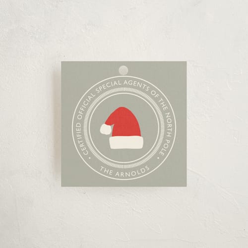 This is a pewter gift tags with standard by Alston Foster called north pole certified printing on signature in tag