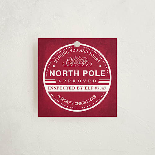 This is a crimson gift tags with standard by Kristen Smith called north pole approved printing on signature in tag