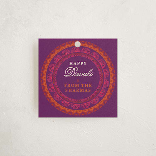This is a violet gift tags by Olivia Raufman called rangoli rings printing on signature in tag