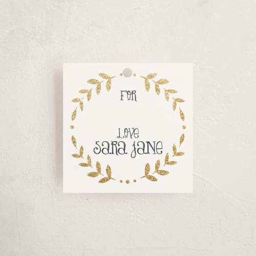 This is a champagne gift tags with standard by Erin Deegan called glittering monogram printing on signature in tag