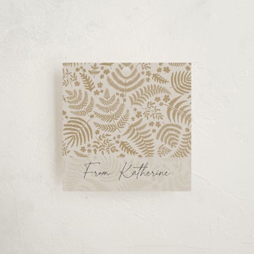 This is a gilded gift tags by Mercedes called gold ferns printing on signature in tag
