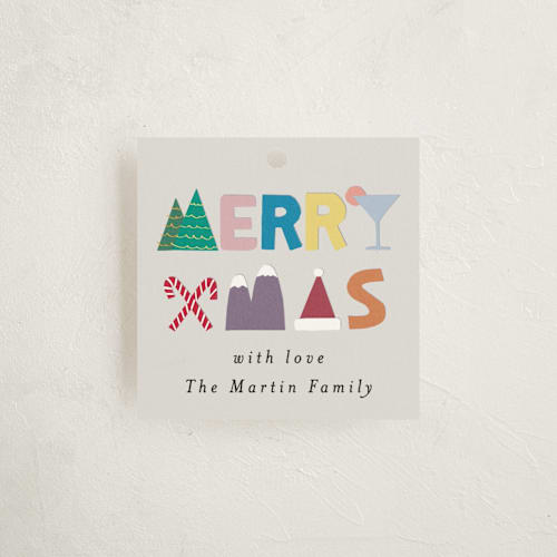 This is a tinsel gift tags by lulu and isabelle called kiddy printing on signature in tag