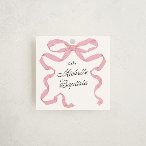 This is a petal gift tags by Olivia Kanaley Inman called antique ribbon printing on signature in tag
