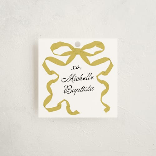 This is a citrine gift tags by Olivia Kanaley Inman called antique ribbon printing on signature in tag