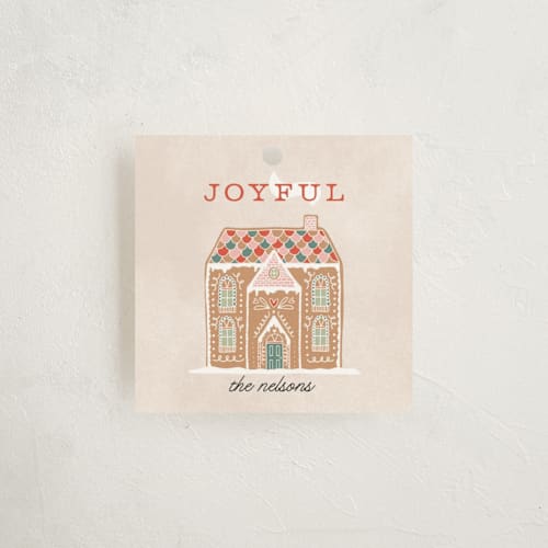 This is a pine gift tags by Pixel and Hank called holiday greetings printing on signature in tag