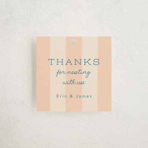 This is a peachy baby shower favor tags with standard by Leia Matt called nesting toolbox printing on signature in tag