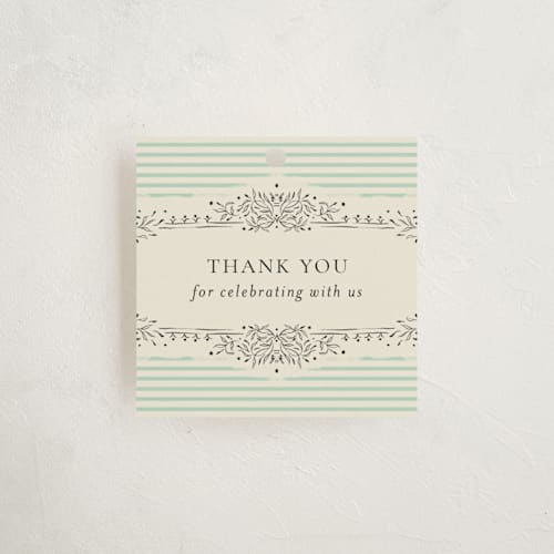 This is a seafoam baby shower favor tags with standard by Jackie Crawford called little welcome printing on signature in tag