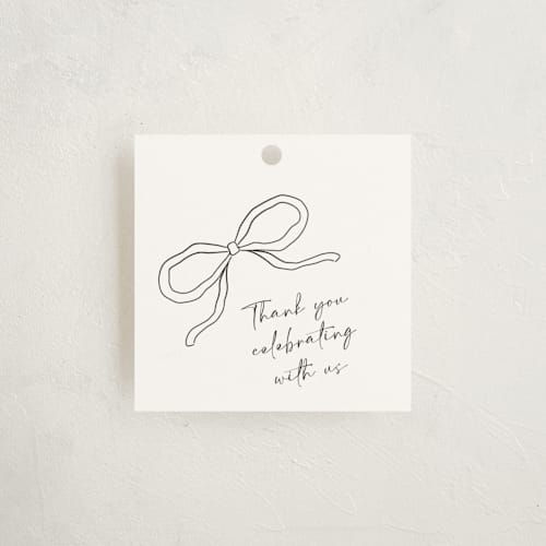 This is a cloud baby shower favor tags with standard by Joyce Pinheiro called tied with love printing on signature in tag