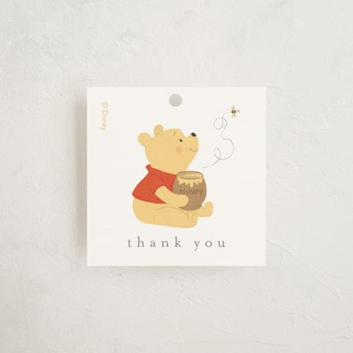 This is a cotton baby shower favor tags with standard by Angela Thompson called disney's pooh hunny pot printing on signature in tag