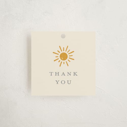 This is a golden sun baby shower favor tags with standard by Meggy Masters called sun toss printing on signature in tag