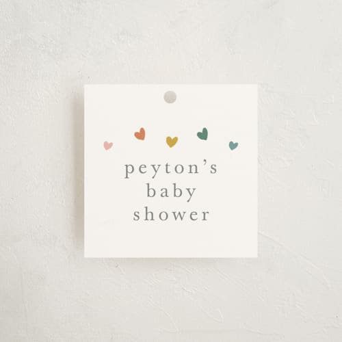 This is a hearts rainbow baby shower favor tags with standard by Stacey Meacham called tiny hearts printing on signature in tag