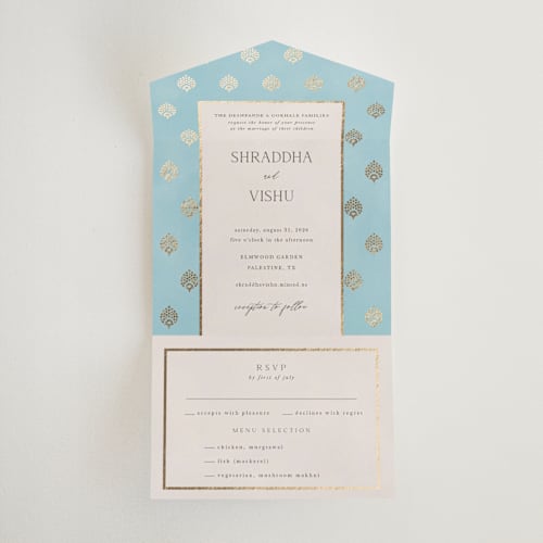 This is a celestial all in one wedding invitations with foil pressed by Deynaaz Daraei called shraddha printing on value cover in all-in-one