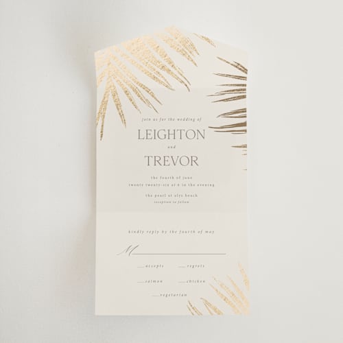 This is a sand all in one wedding invitations with foil pressed by Melinda Denison called gilded palm printing on value cover in all-in-one