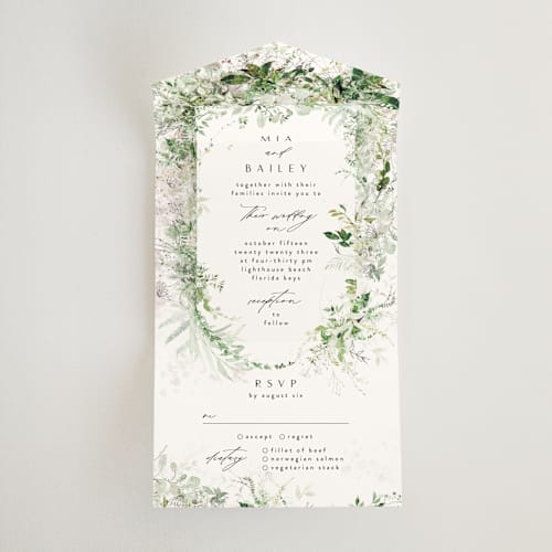 This is a fresh green all in one wedding invitations with standard by Phrosné Barwood called lush greenery printing on value cover in all-in-one