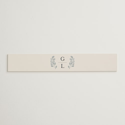 This is a dusty blue belly bands with standard by Jen Owens called embroidered printing on signature text in belly band