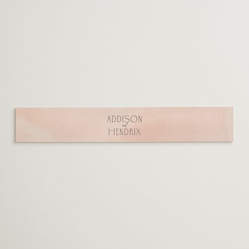 This is a blush belly bands with standard by Itsy Belle Studio called first light printing on signature text in belly band