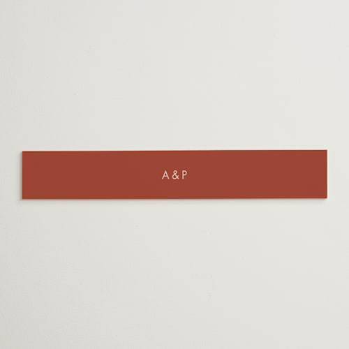 This is a peach cream belly bands with standard by Snow and Ivy called jot printing on signature text in belly band