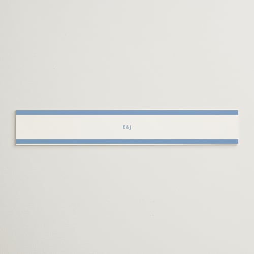 This is a blue bell belly bands with standard by Megan Davis called montauk printing on signature text in belly band