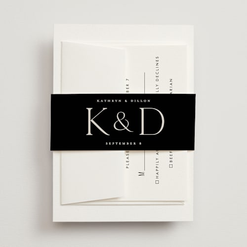 This is a ecru belly bands with standard by Erica Krystek called modern monogram printing on signature text in belly band