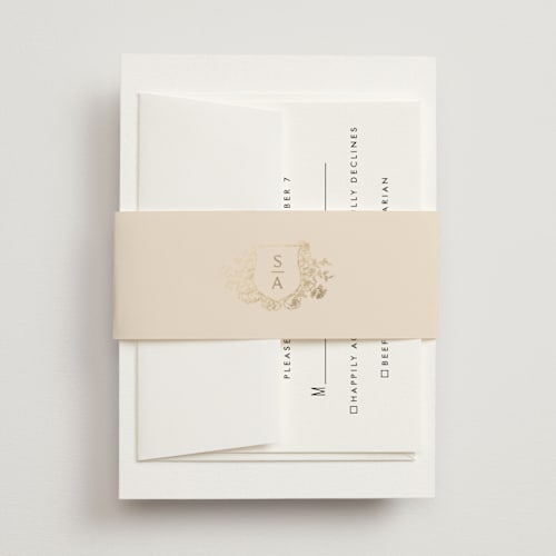 This is a champagne belly bands with foil pressed by Cass Loh called floral crest printing on signature text in belly band