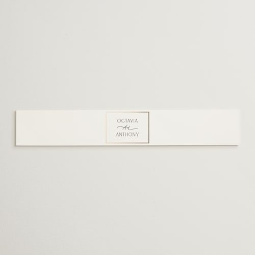 This is a porcelain belly bands with foil pressed by Nicole Walsh called regal printing on signature text in belly band