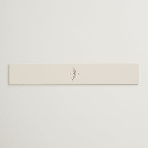 This is a ivory belly bands with foil pressed by Carolyn Nicks called to hold printing on signature text in belly band