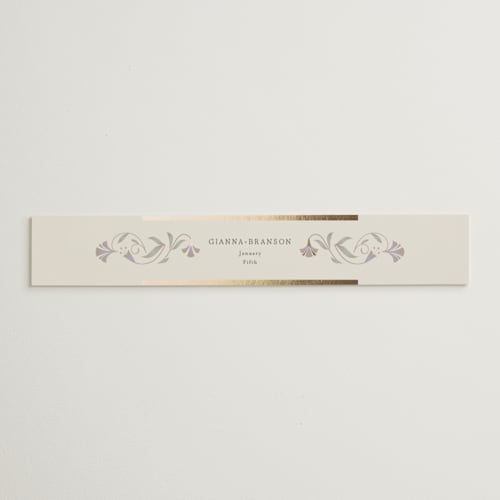 This is a vanilla belly bands with foil pressed by Lori Wemple called deco nouveau printing on signature text in belly band