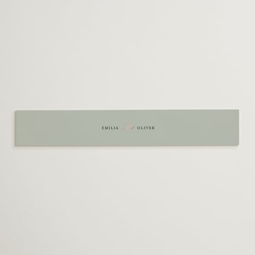 This is a sage belly bands with foil pressed by Angela Thompson called gilded script printing on signature text in belly band