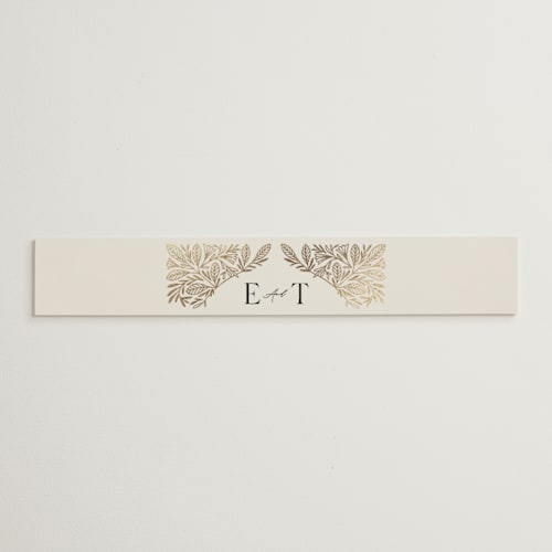 This is a cream belly bands with foil pressed by Jen Owens called baroque printing on signature text in belly band