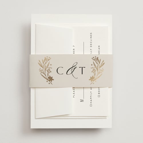 This is a champagne belly bands with foil pressed by Leah Bisch called floral border printing on signature text in belly band