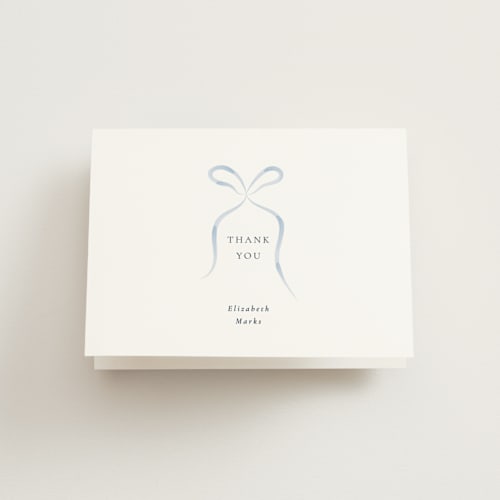 This is a dusty blue bridal shower thank you cards with standard by Corinne Malesic called bow printing on strathmore in standard
