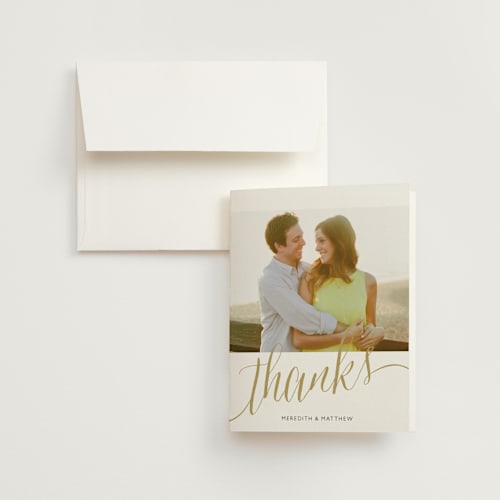 This is a gold wedding thank you cards with standard by Erin Deegan called raise a glass printing on strathmore in standard