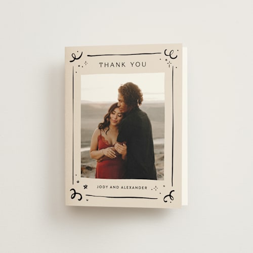 This is a creme wedding thank you cards with standard by Anastasia Makarova called cheers to a happy couple printing on strathmore in standard