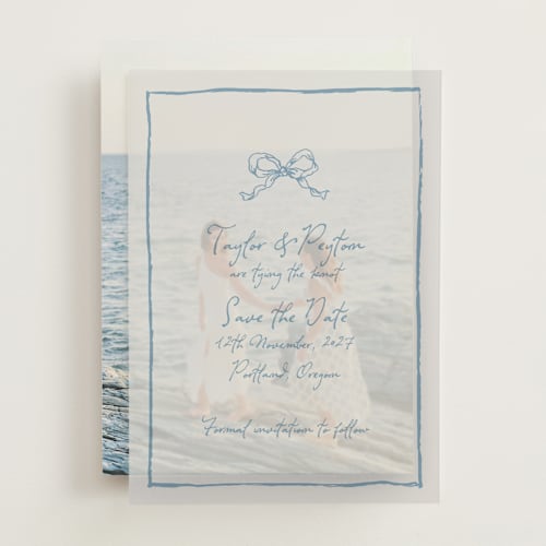 This is a dusty blue vellum overlays with standard by Cass Loh called ribbon bow drawing printing on translucent vellum in overlay
