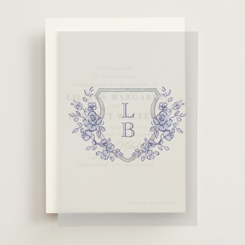 This is a dusty blue vellum overlays with standard by Cass Loh called watercolor flowers crest printing on translucent vellum in overlay