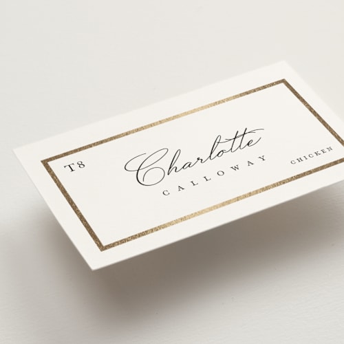 This is a ivory wedding place cards with foil pressed by Lucrecia Caporale called regal frame printing on signature in placecard