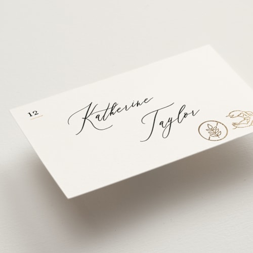 This is a ivory wedding place cards with foil pressed by Creo Study called gilded icons printing on signature in placecard